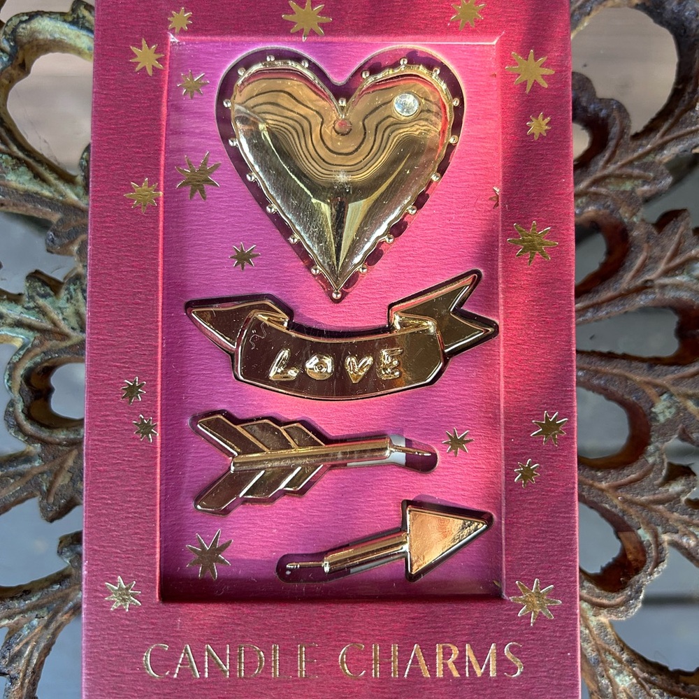 Anthropologie Gold Candle Charms on Pink Display